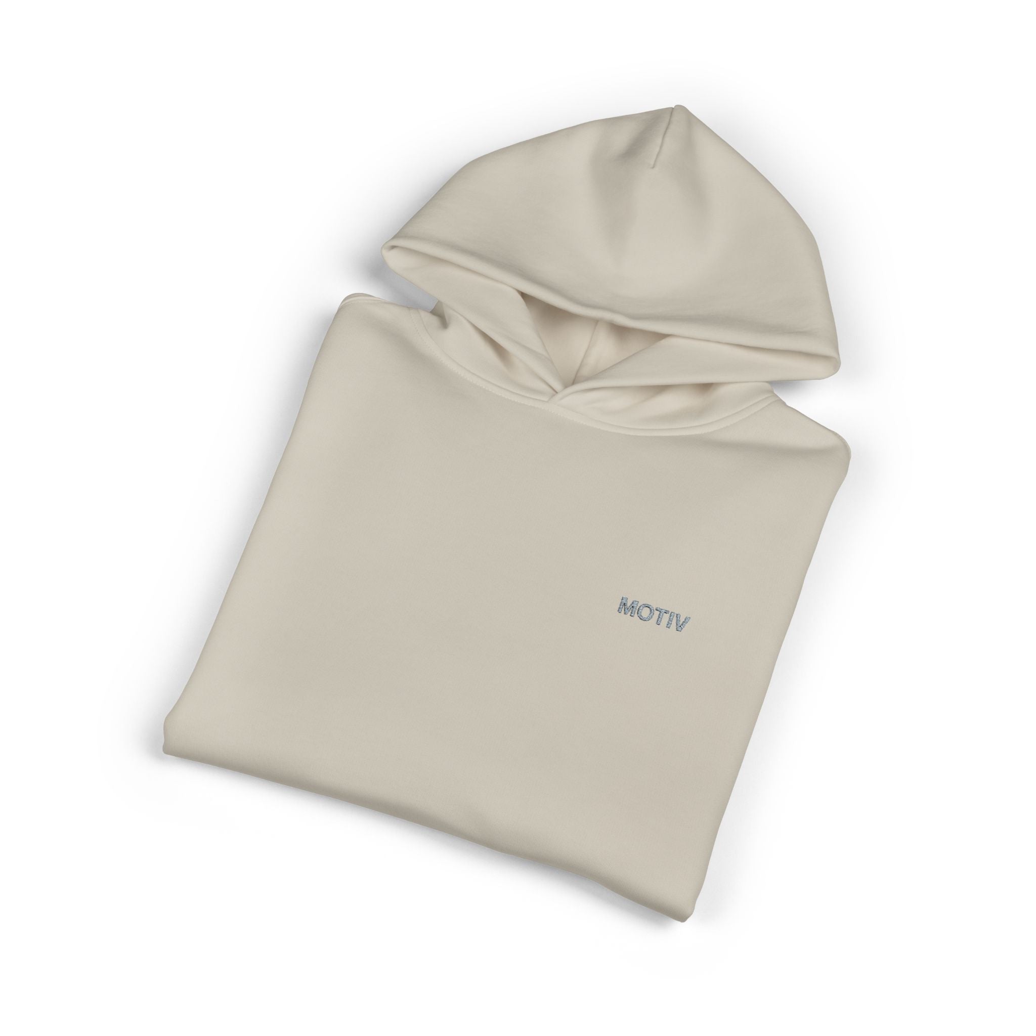 Folded beige hoodie with 'MOTIV' branding on a white background