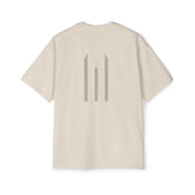 Beige t-shirt with a logo on the back against a white background